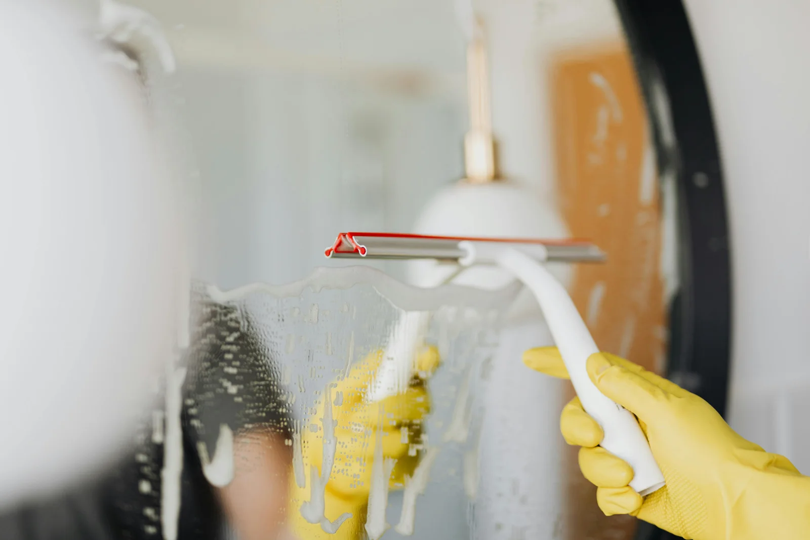 Illustrative photograph of cleaning a glass surface