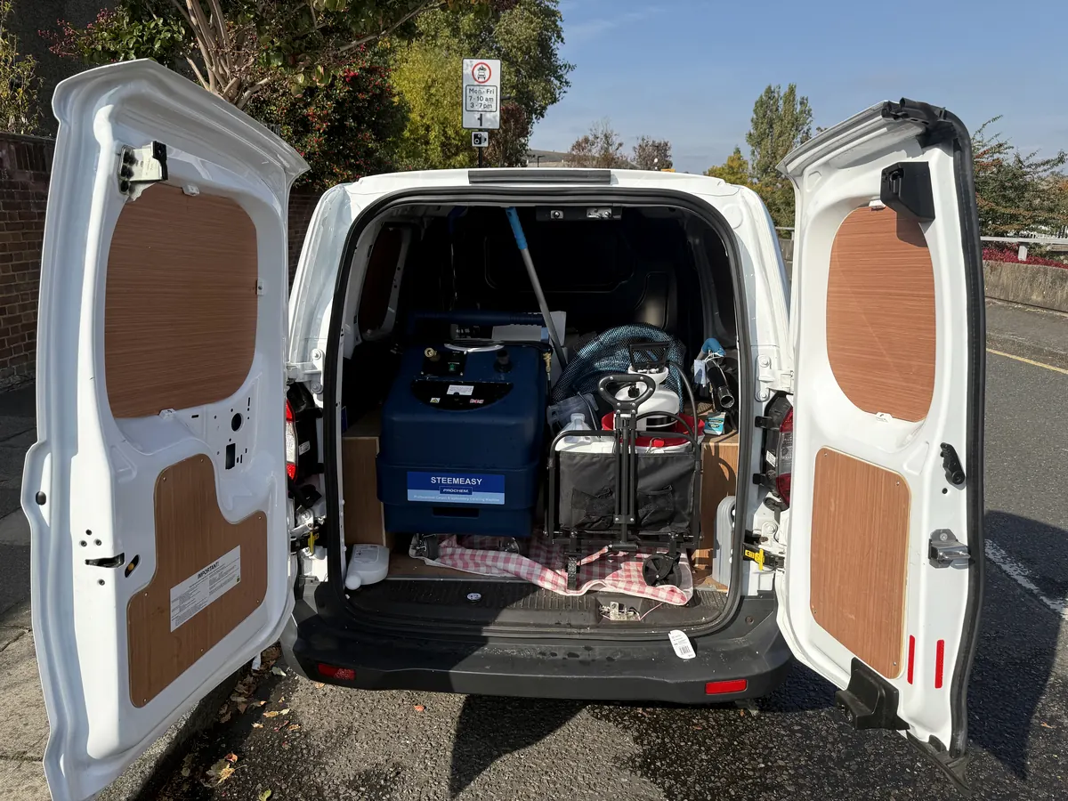 Van loaded with commercial extraction machine, hoses and cleaning equipment